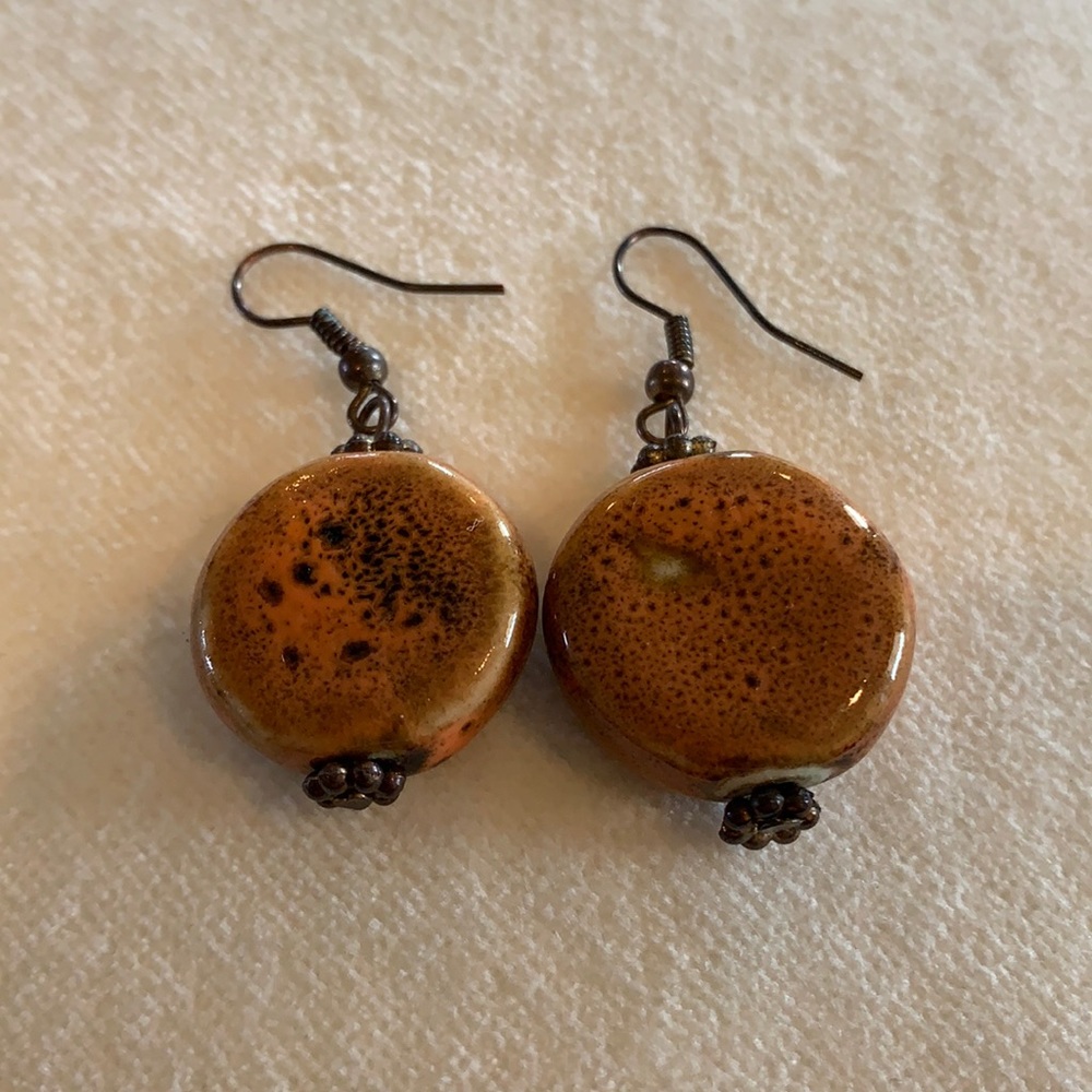 Beautiful handmade circular brown/burnt orange drop earrings